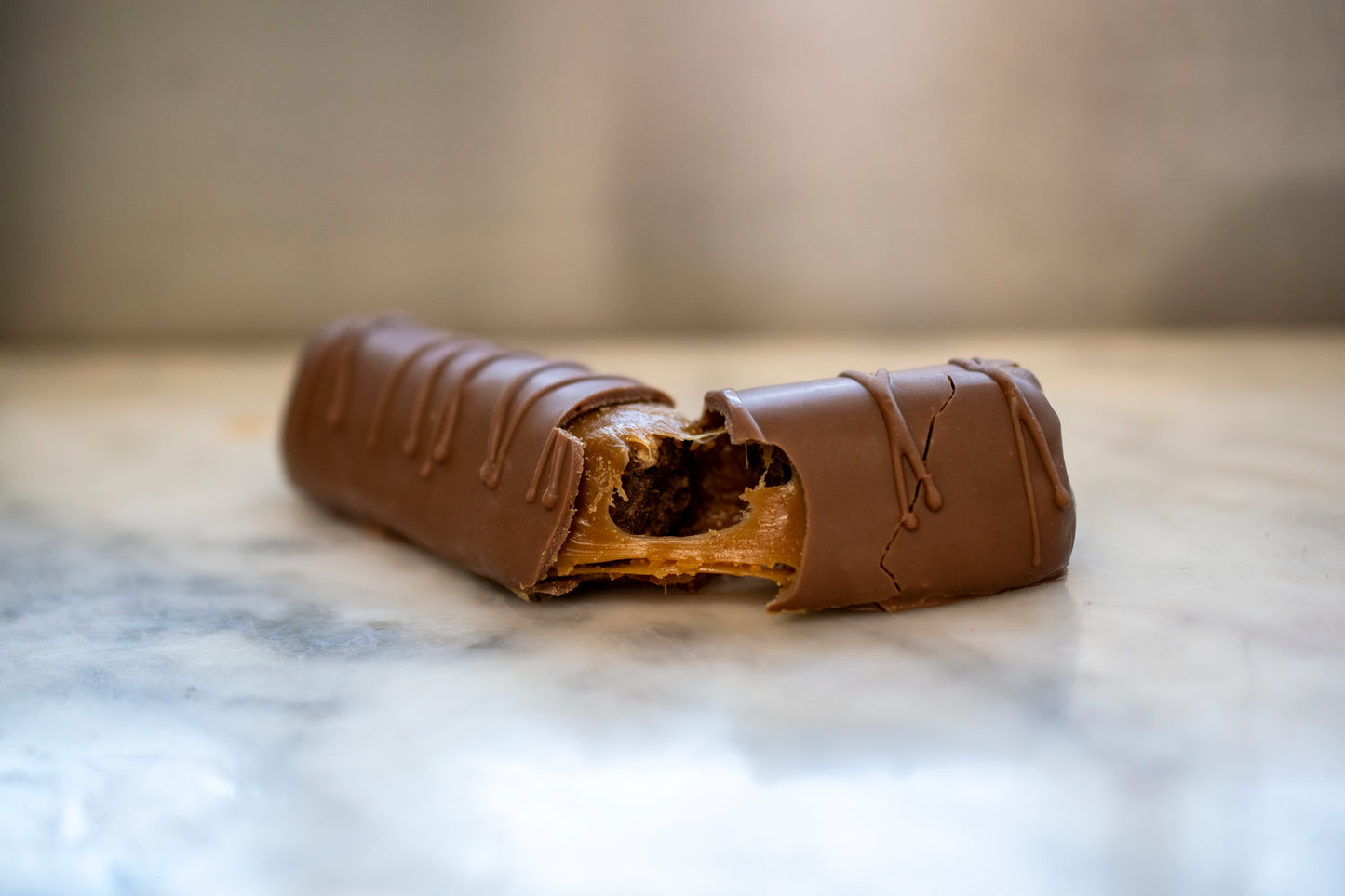 Sliced artisan Irish Surprise Bar showing caramel and airy chocolate nougat, a handmade birthday gifting idea