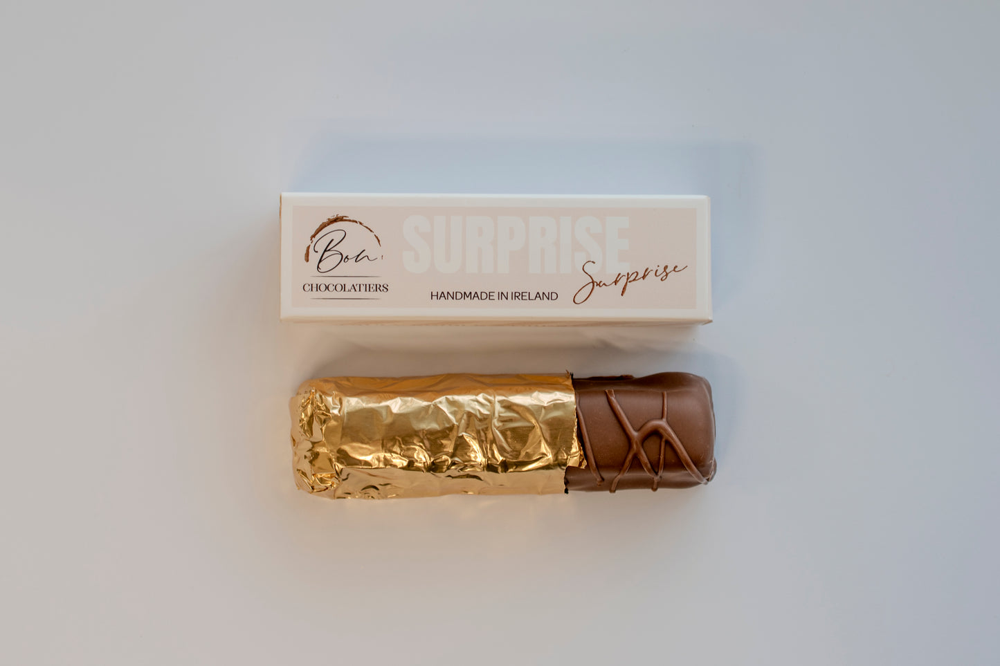 Gold-wrapped artisan Irish Surprise Bar by Bon Chocolatiers, a luxury gifting idea for him on any occasion